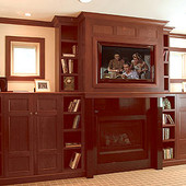 Bookcases and Fireplace Surround, built-ins: stained walnut.