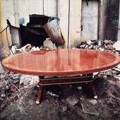 Dining table:  Cherry with quarter cut cherry border with gold leaf accents.