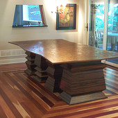 Dining table: glass, Macassar Ebony with clear natural finish.