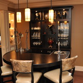 Bar with Display Cabinets, built-in: stained Macassar ebony bar top with "sunbur